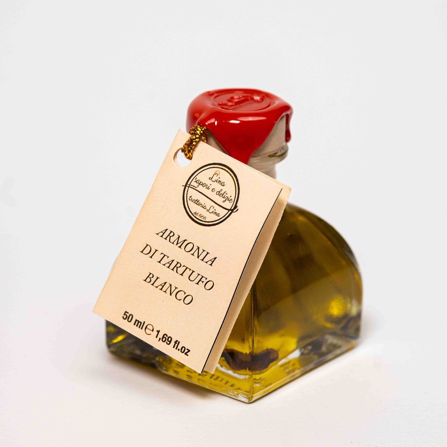 Bottiglia di olio al tartufo bianco con tartufo essiccato – Lina Sapori e Delizie, Savigno